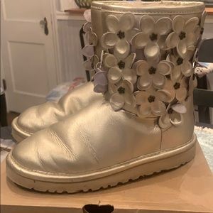 Gold Ugg boots with flowers